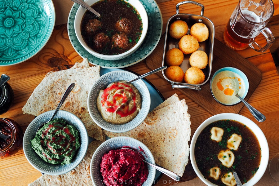 A table of vibrant Georgian dishes at Culinarium cafe in Tbilisi.