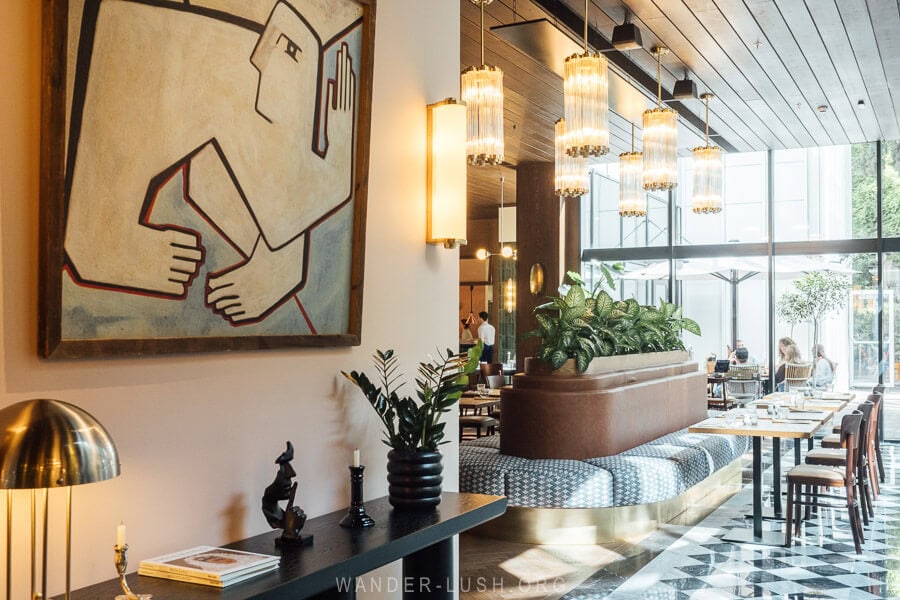 Iakobis Ezo, a new restaurant in Tbilisi with black-and-white tiled floors and art on the walls.