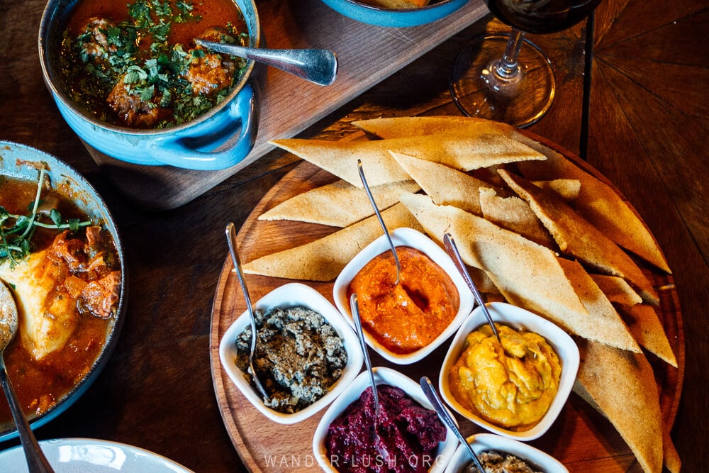 Bozbashi and assorted vegetable dips at Makashvilebtan 2022 restaurant in Tbilisi, Georgia.