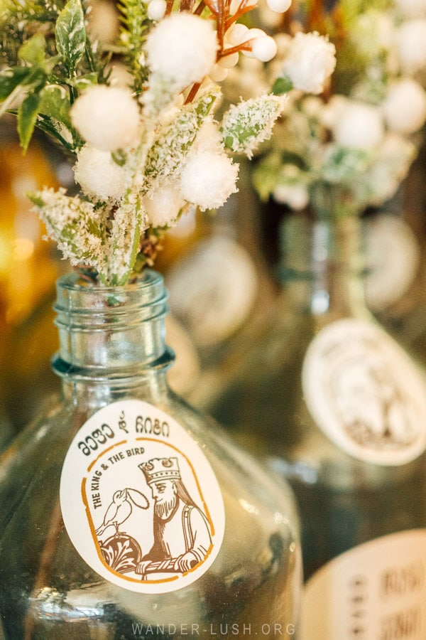 Logo of King Vakhtang and his pheasant on a flower bottle.