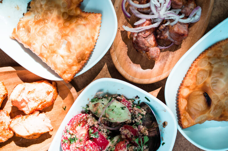 A table covered with plates of colourful food at Maspindzelo in Tbilisi Old Town.