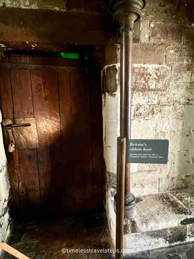 Image of the oldest door in Britain, located at Westminster Abbey. This late Saxon oak door, dating back to around AD 1050, features robust iron hinges and traces of cowhide. Despite its age, the door remains well-preserved, showcasing the craftsmanship of the medieval period.
