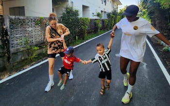 Emma Joy Obanye pictured with her partner Irene and their twins