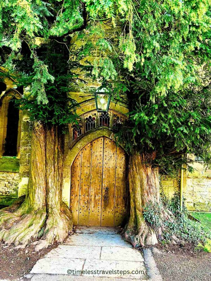 the famed 'Tolkien' Door flanked by two yew trees that is said to have inspired the Doors of Durin