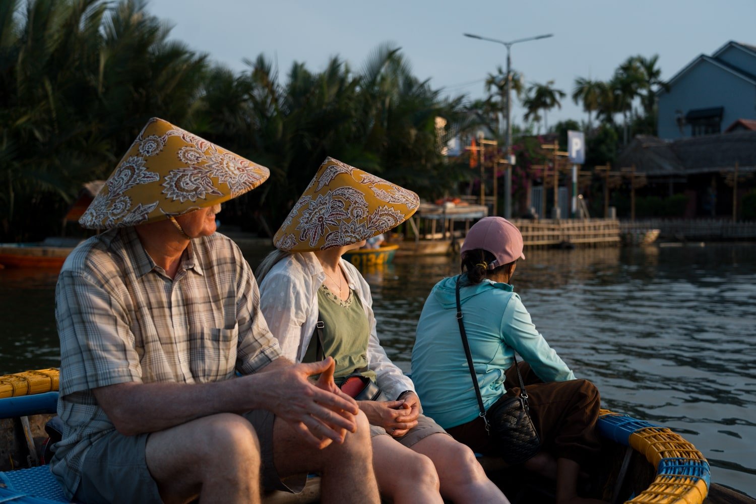 A family on the Hoi An basket boat tour with a local Vietnamese guide.