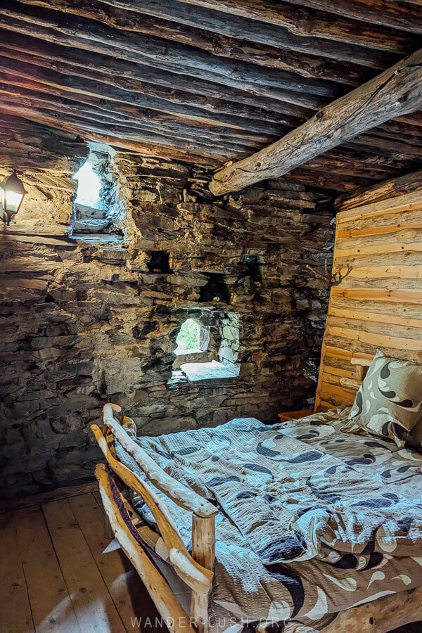 A handmade bed inside a tower house at a hotel in Shatili.