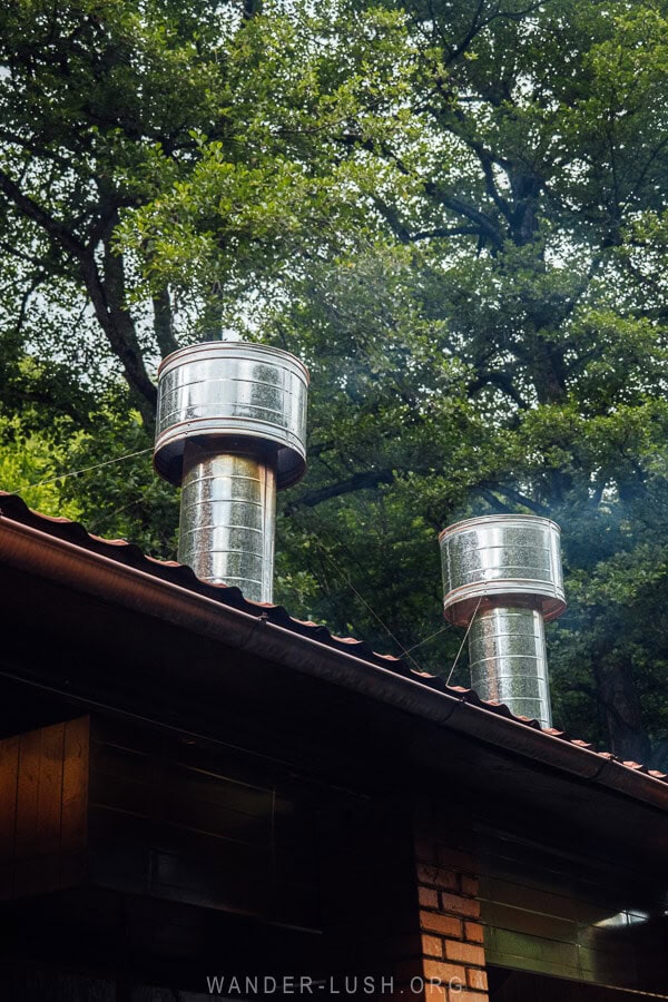 Smoke stacks on the roof of an outdoor kitchen at a restaurant in the mountains of Georgia.