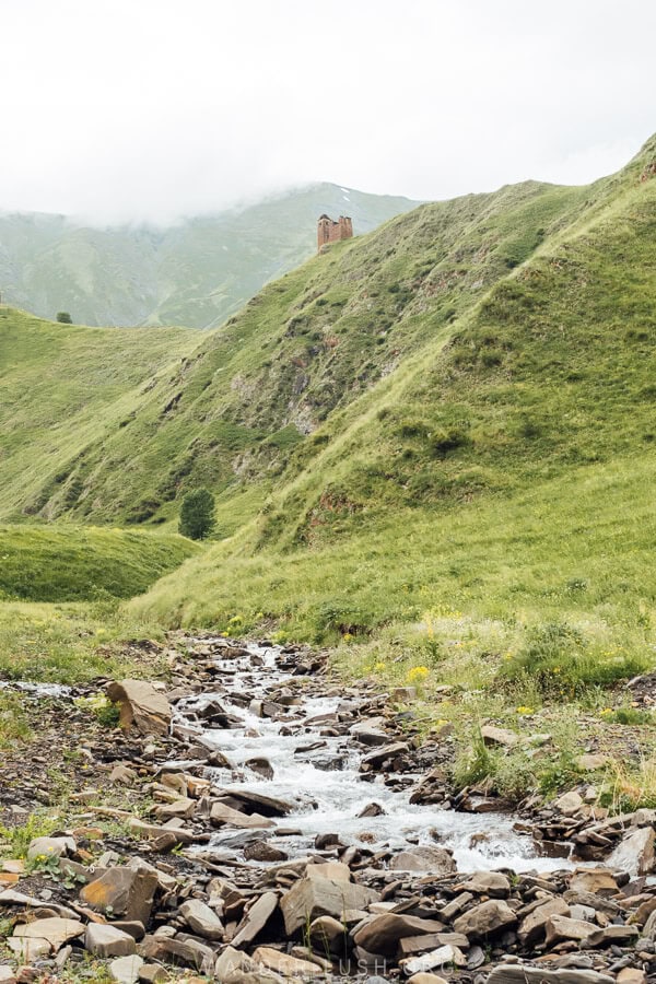 An ancient fortress in a valley in Khevsureti, Georgia.