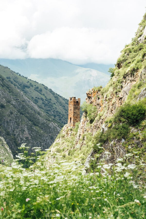 Torghva's Tower, an ancient watchtower above a river valley in Khevsureti.