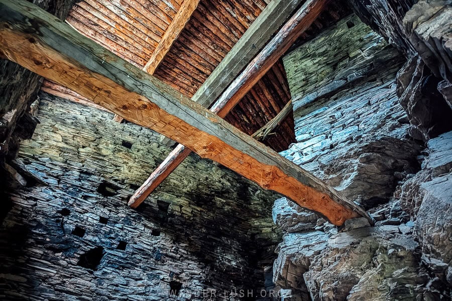 Wooden beams and a platform inside one of the ancient tower houses in Shatili, Georgia.