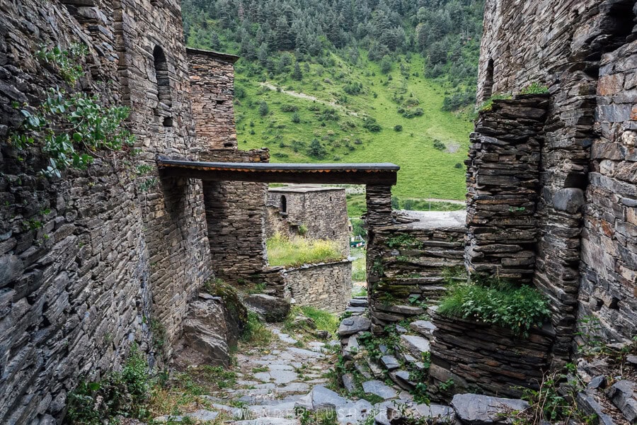 A wooden platform between two stone houses in Shatili, Georgia.