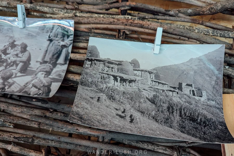 Old photographs of Shatili show men in traditional costume and ancient towers.