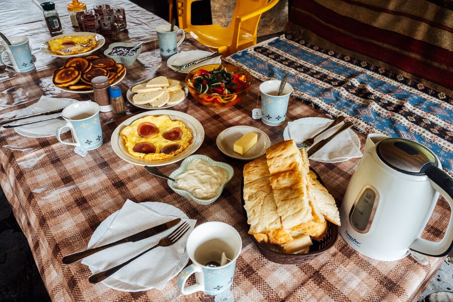 A Georgian breakfast with omelette, cheese and salad served at a family guesthouse in Shatili, Georgia.