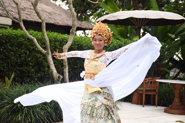 Balinese dancer Dewi Aryani performs for travelers during a special presentation