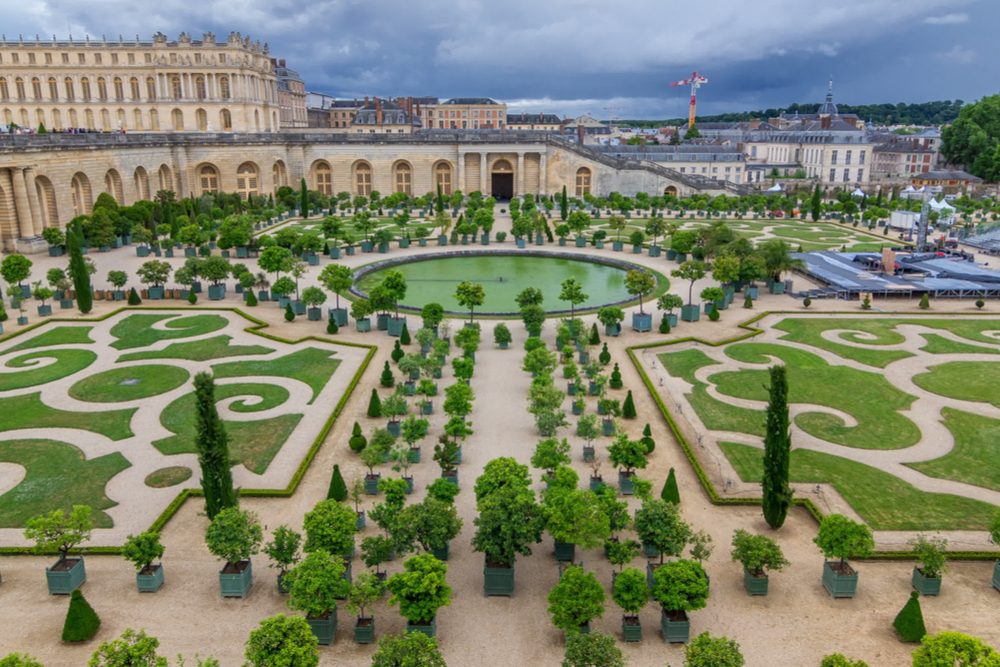 aerial view of Famous palace Versailles with beautiful gardens and fountains in France