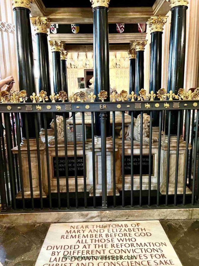 The ornate tombs of Elizabeth I and Mary I in Westminster Abbey, featuring detailed carvings and inscriptions. The tomb is located in a small side room off the main Henry VII Lady Chapel and commemorates the historical significance of both monarchs
