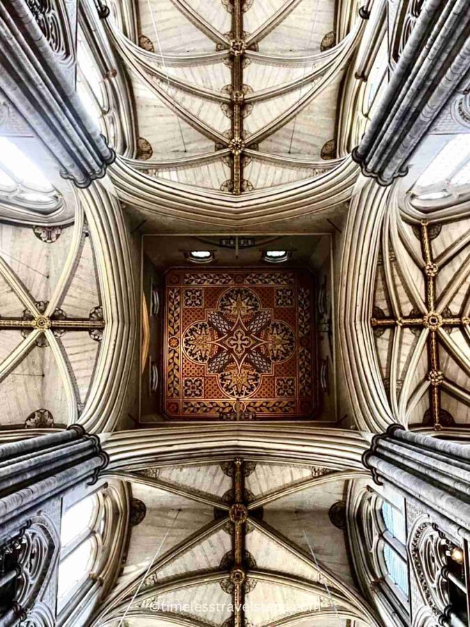 Image of the crossing ceiling at Westminster Abbey, where the four naves meet, showcasing intricate Gothic ribbed vaulting and detailed stonework
