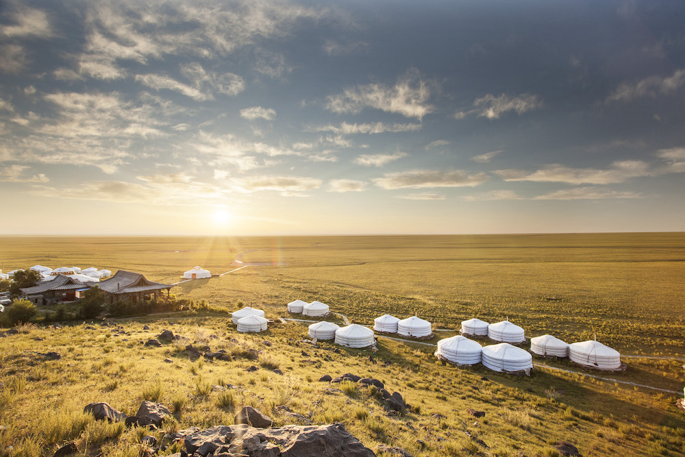 Ger yurt tents at Three Camel Lodge in Gobi Desert of Mongolia at sunrise