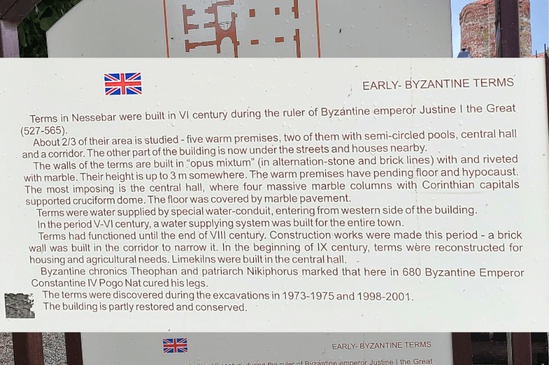 A sign for the Roman bath ruins in old town Nessebar outlines their history including being built in the 6th century during Justine the Great's rule. The baths were once 5 warm premises with impressive columns and marble floors. They were in operation until the end of the 8th century.