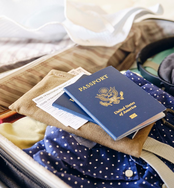 International Travel Packing List: lifestyle image of Suitcase and Passport