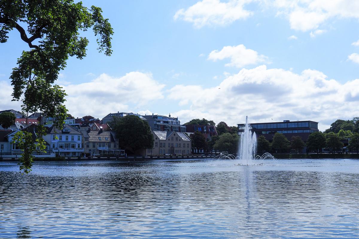 Breiavatnet Lake and fountain, Stavanger, Norway, waterfront buildings, clear skies