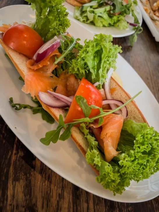 Norwegian smoked salmon sandwich with fresh vegetables in Stavanger, Norway