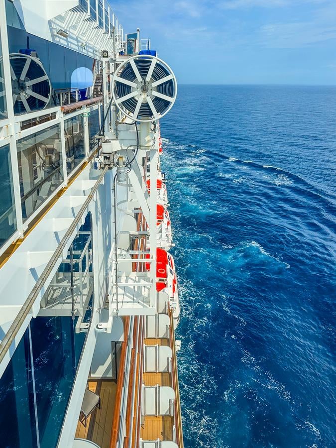 MS Rotterdam cruising North Sea with lifeboats and crystal blue water