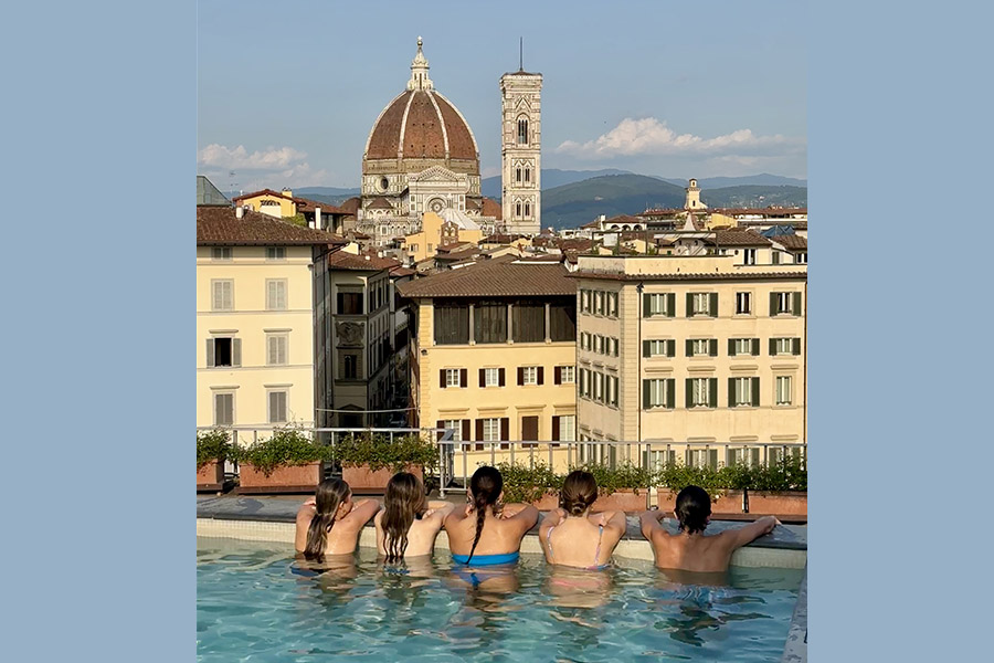 Andrea's family enjoying the view of Florence from the rooftop pool.