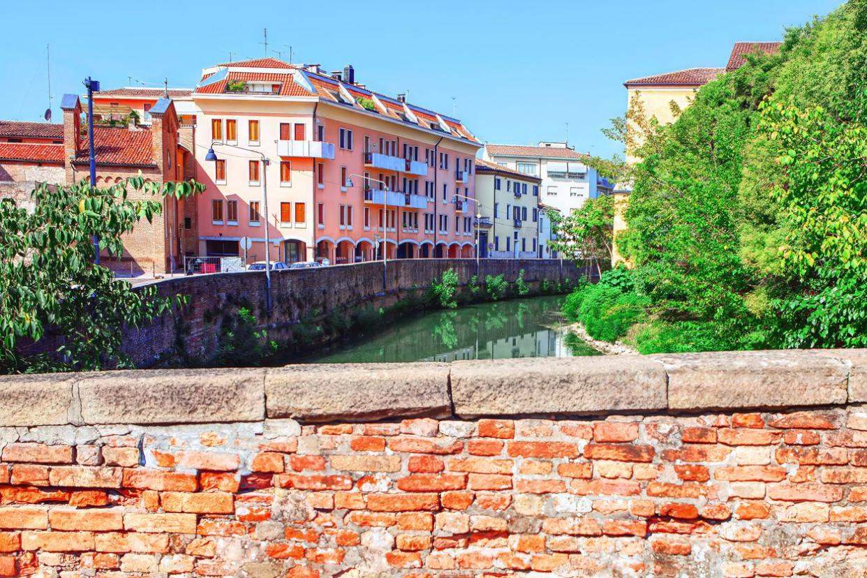 View of residential houses and river in Padua