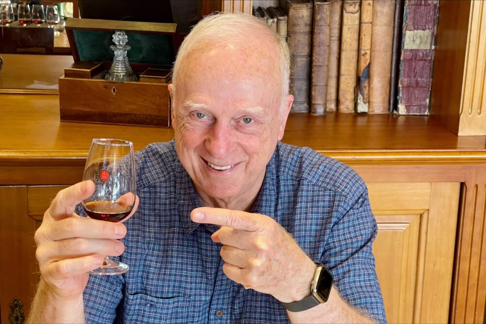 Traveler tasting 50 year old Port at the Taylor Floodgate Quinta in Porto, Portugal.