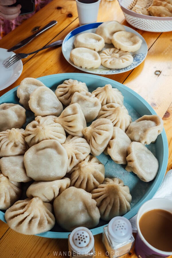 A blue platter of khinkali dumplings at a roadside restaurant in Georgia.