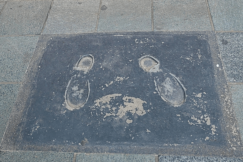 Gavrilo Princip's footprints stamped in the sidewalk in Sarajevo Bosnia