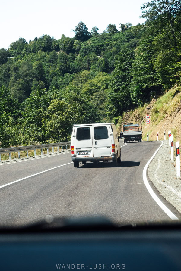 Vans on the well-kept highway to Bakhmaro.