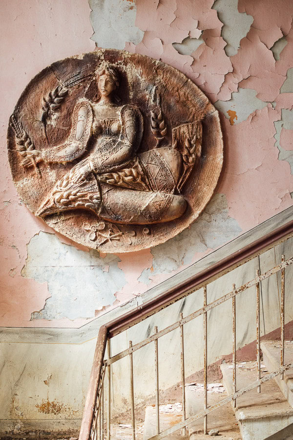 A Soviet medallion decorates the flaking stairwell of a village culture house in Georgia's Guria region.