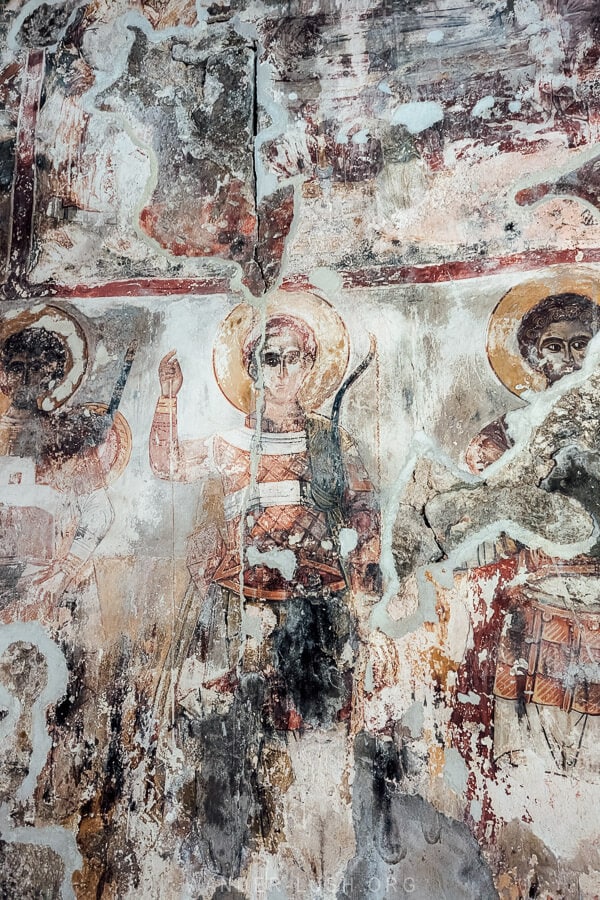 Shemokmedi Church frescoes depicting faded figures in Georgia.