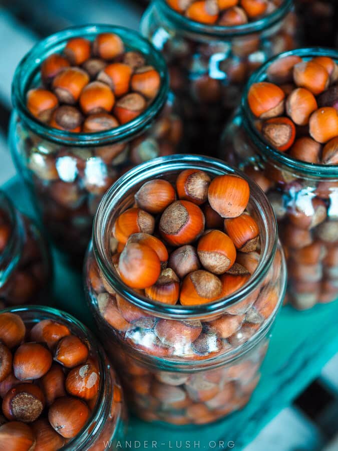 Jars of nuts for sale at a market in Guria.