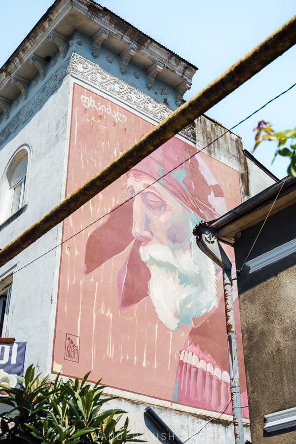 A beautiful mural in the city of Ozurgeti depicts an old man dressed in traditional Georgian costume.