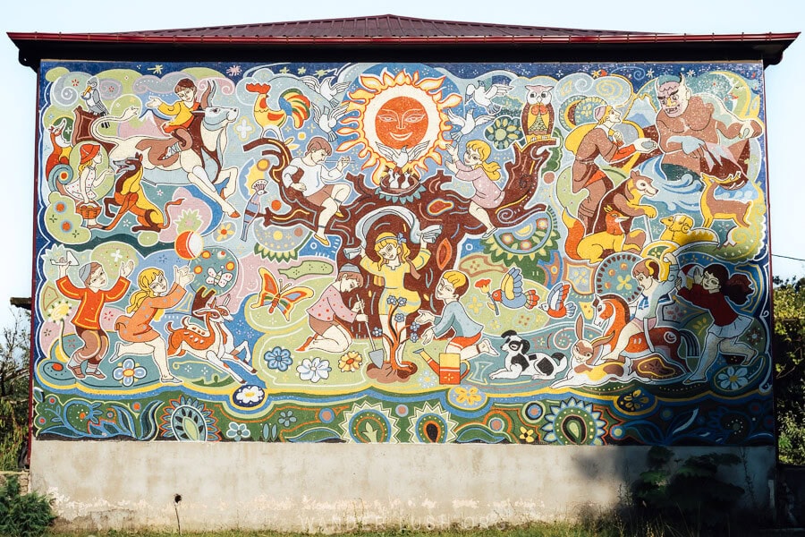 A wall of Soviet mosaics depicting children and different fairytales and legends.