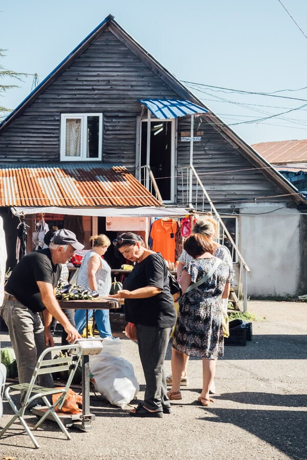 People shop at the Sunday market in Chokhatauri, Georgia.