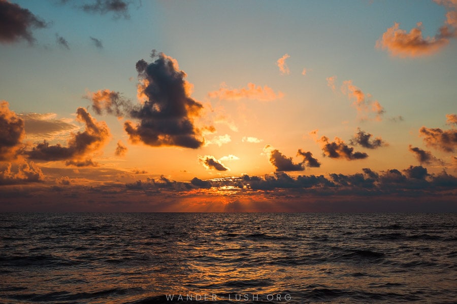 A vivid sunset over the Black Sea in Shekvetili, Georgia.