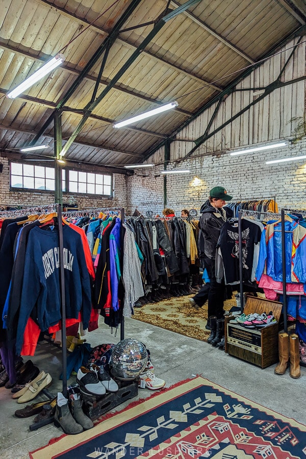 A warehouse filled with vintage clothes at Dezerter Vintage, a popular thrift shop in Tbilisi inside the Dezerter Bazaar market.