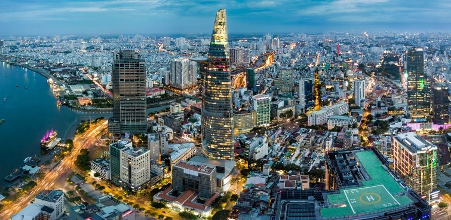 Skyline view of Ho Chi Minh City at dusk with city lights visible 