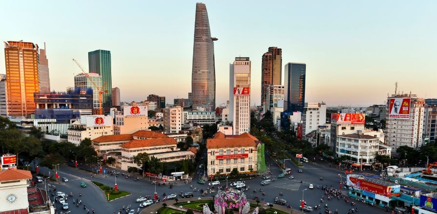 Skyline of Ho Chi Minh city, roundabout in forefront of image, skyscrapers in the background 