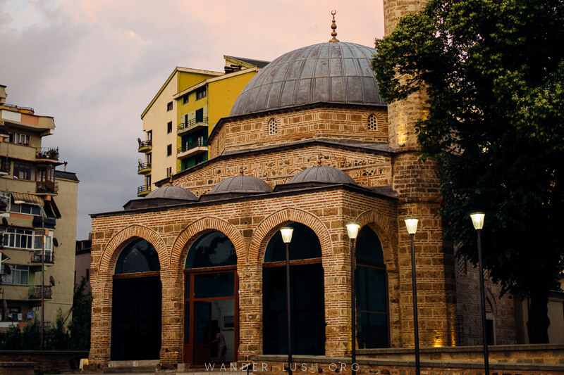 A mosque lit up at night.