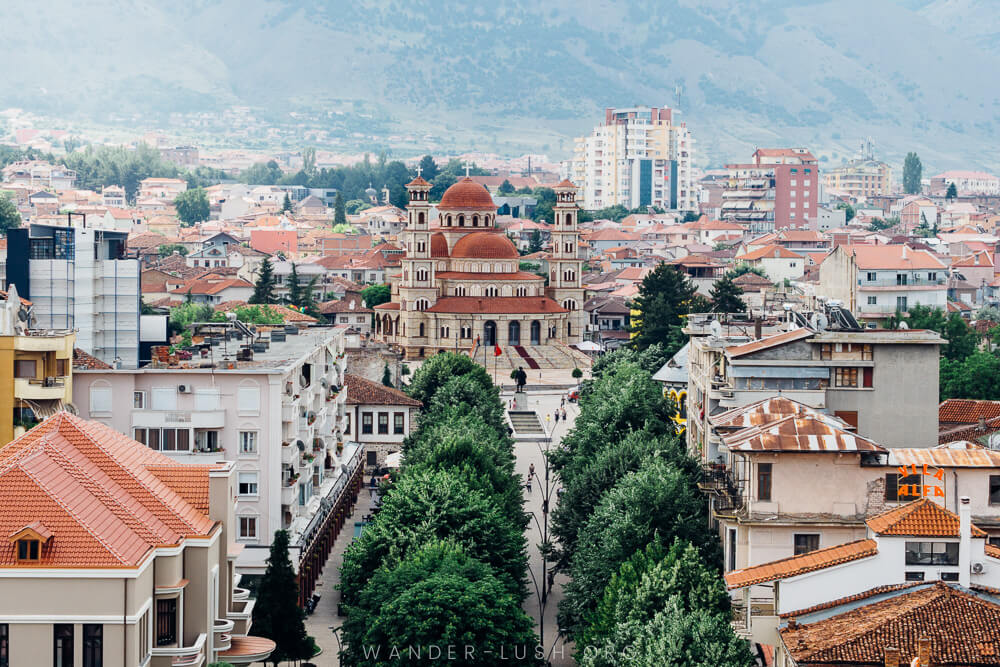 A city and large church with tree-lined streets.