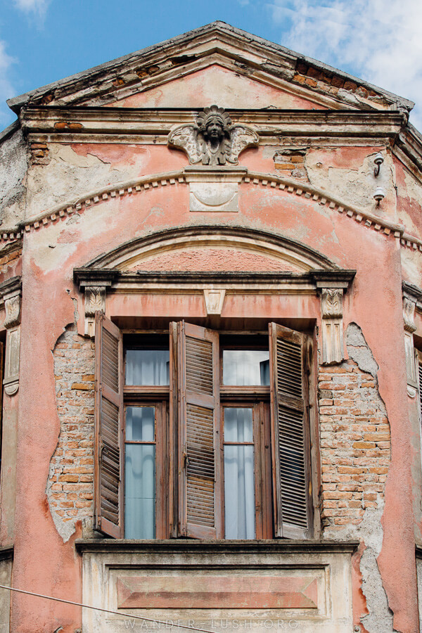 A crumbling pink facade.