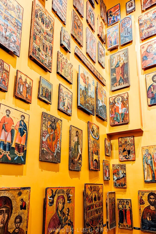 A golden wall of icon paintings inside the National Museum of Medieval Art in Korca, Albania.