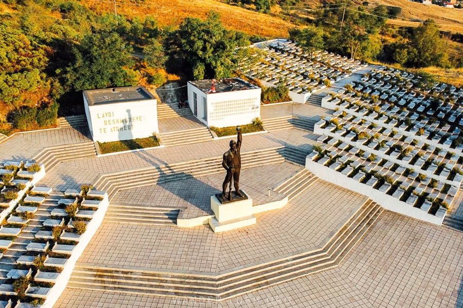 A monument of a partisan fighter with his fist raised to the sky in Korca, Albania.