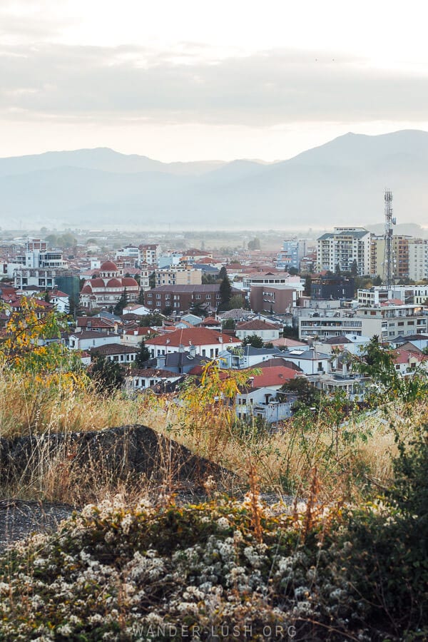 Rooftops of Korca at sunset, panoramic sunset view from the Martyrs Cemetery.