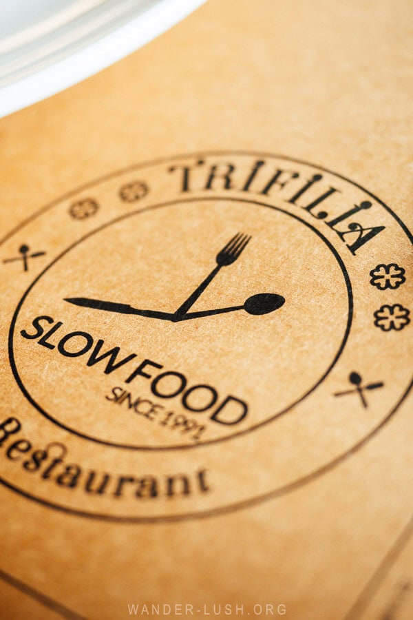 A Slow Food logo at a restaurant in Albania.